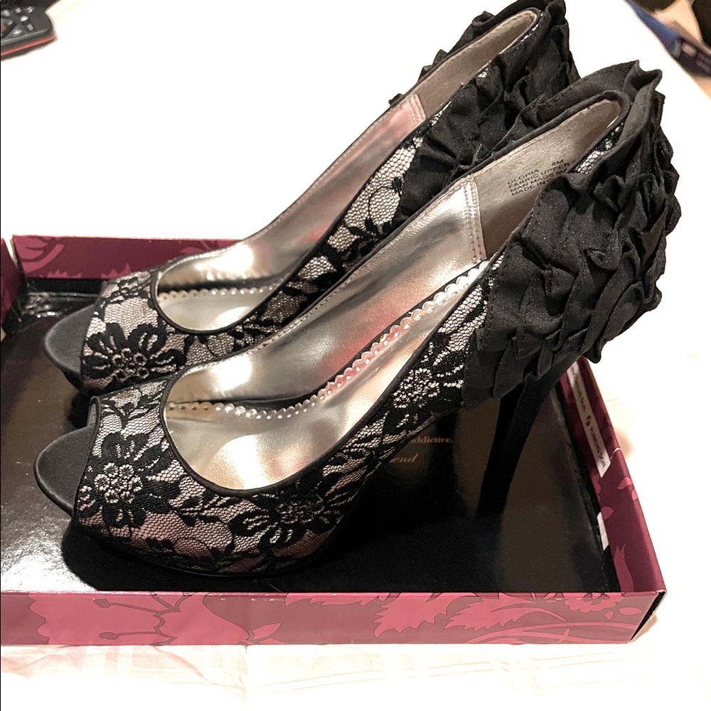 Black pumps embellished heels. Never worn